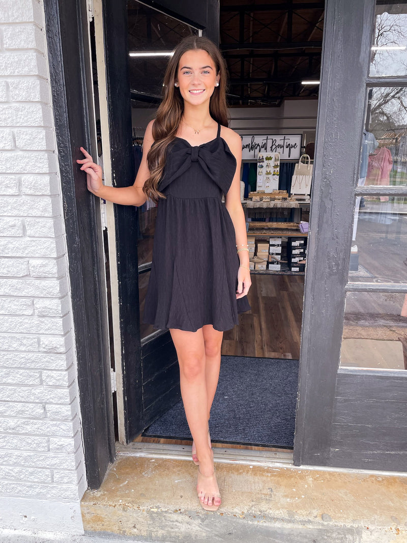 Leslie's LBD with bow accent