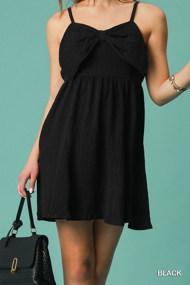 Leslie's LBD with bow accent