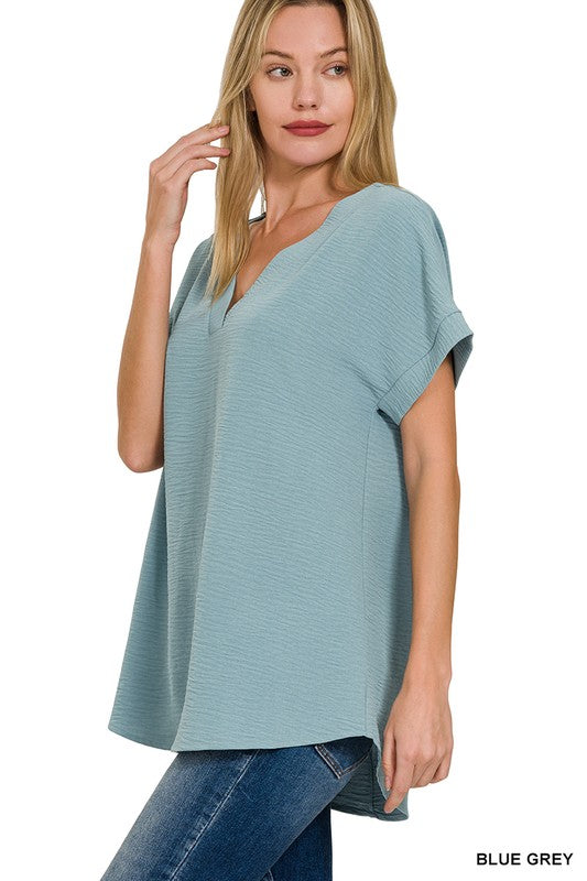 WOVEN AIRFLOW HI-LOW HEM TOP